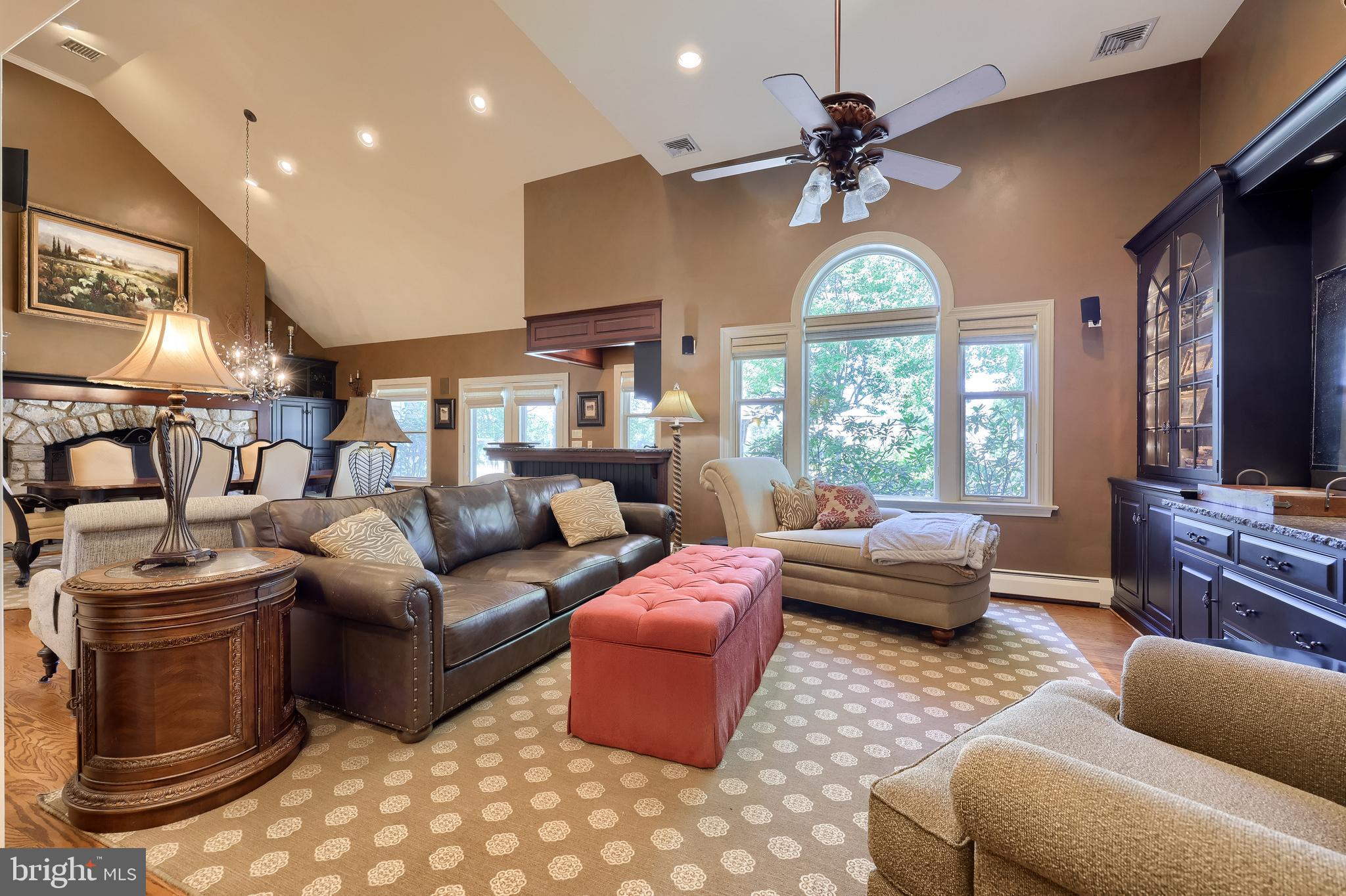 38 Westwind Circle Lititz, PA 17543 - Photo 15 of 113 a living room with furniture a fireplace and a chandelier