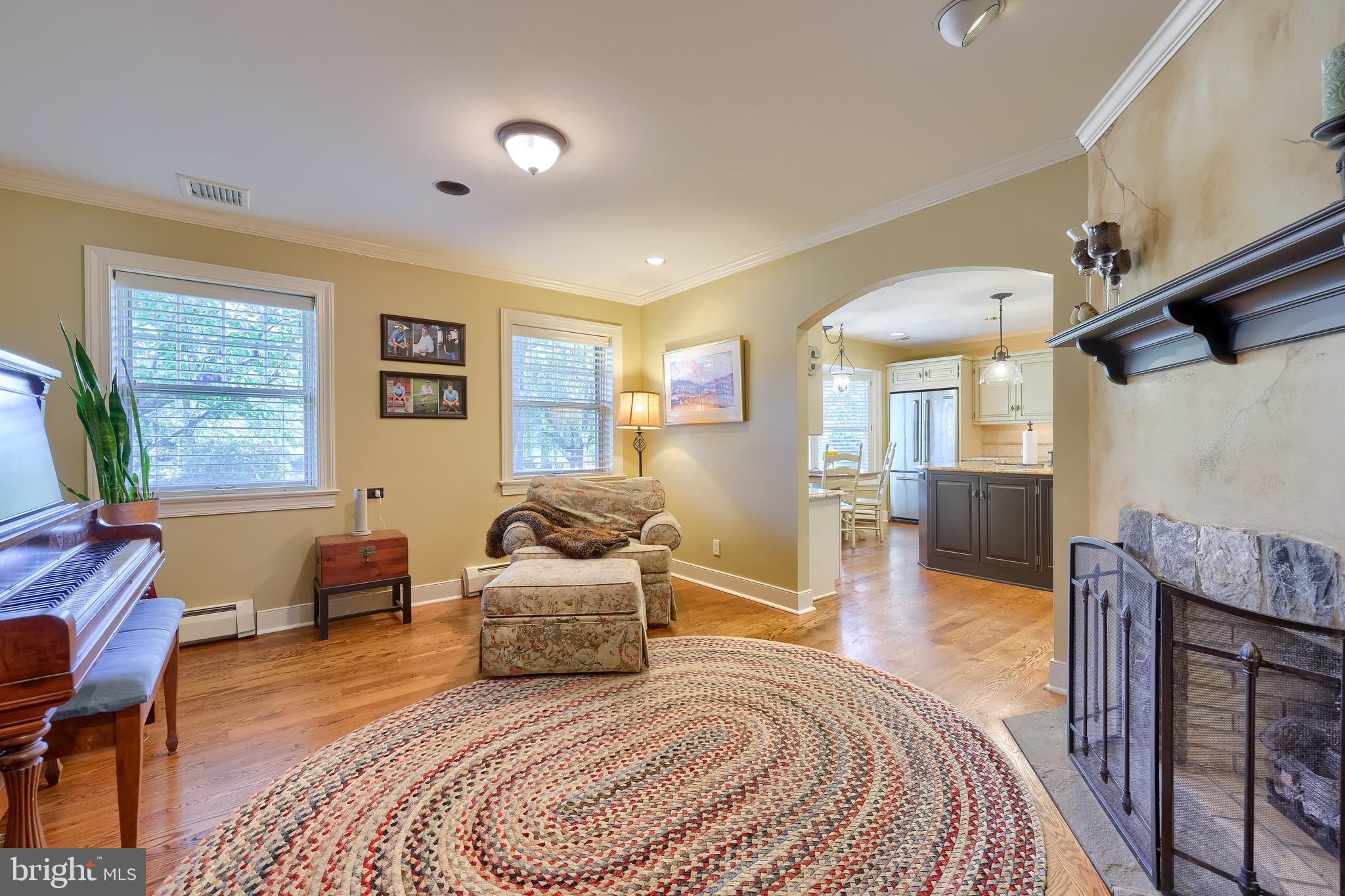 38 Westwind Circle Lititz, PA 17543 - Photo 33 of 113 a spacious bedroom with a bed a table and chair with the wooden floor