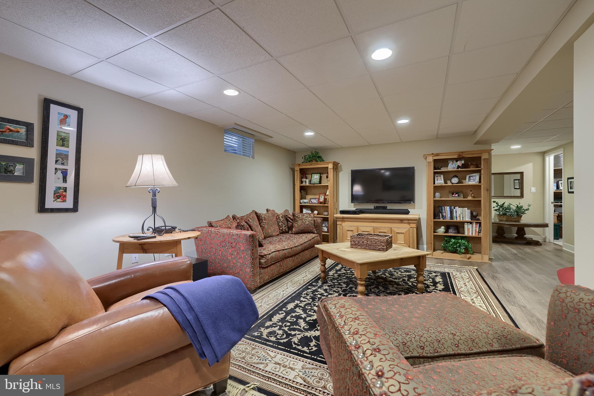 38 Westwind Circle Lititz, PA 17543 - Photo 56 of 113 a living room with furniture and a flat screen tv