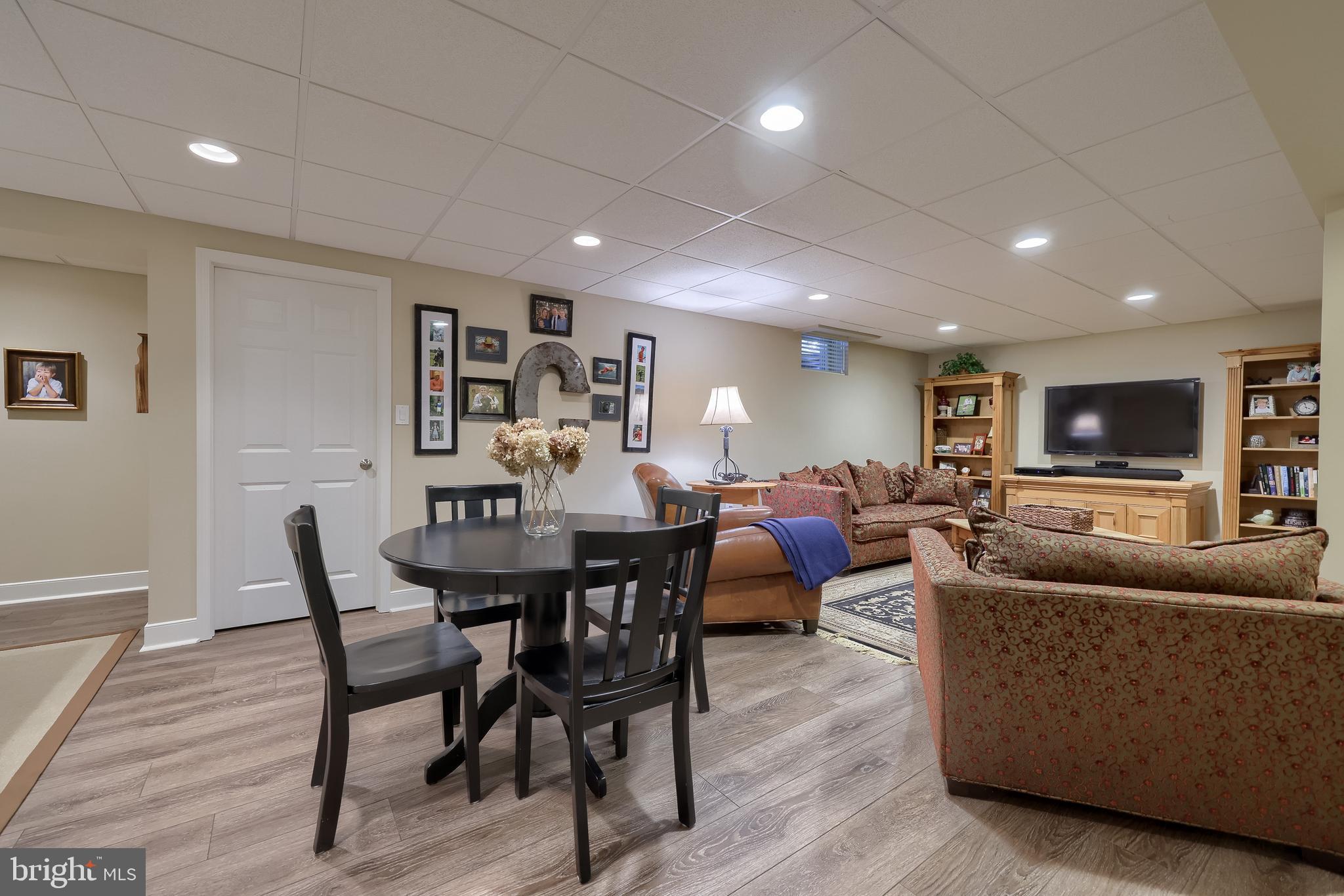 38 Westwind Circle Lititz, PA 17543 - Photo 61 of 113 a living room with furniture a rug and a flat screen tv