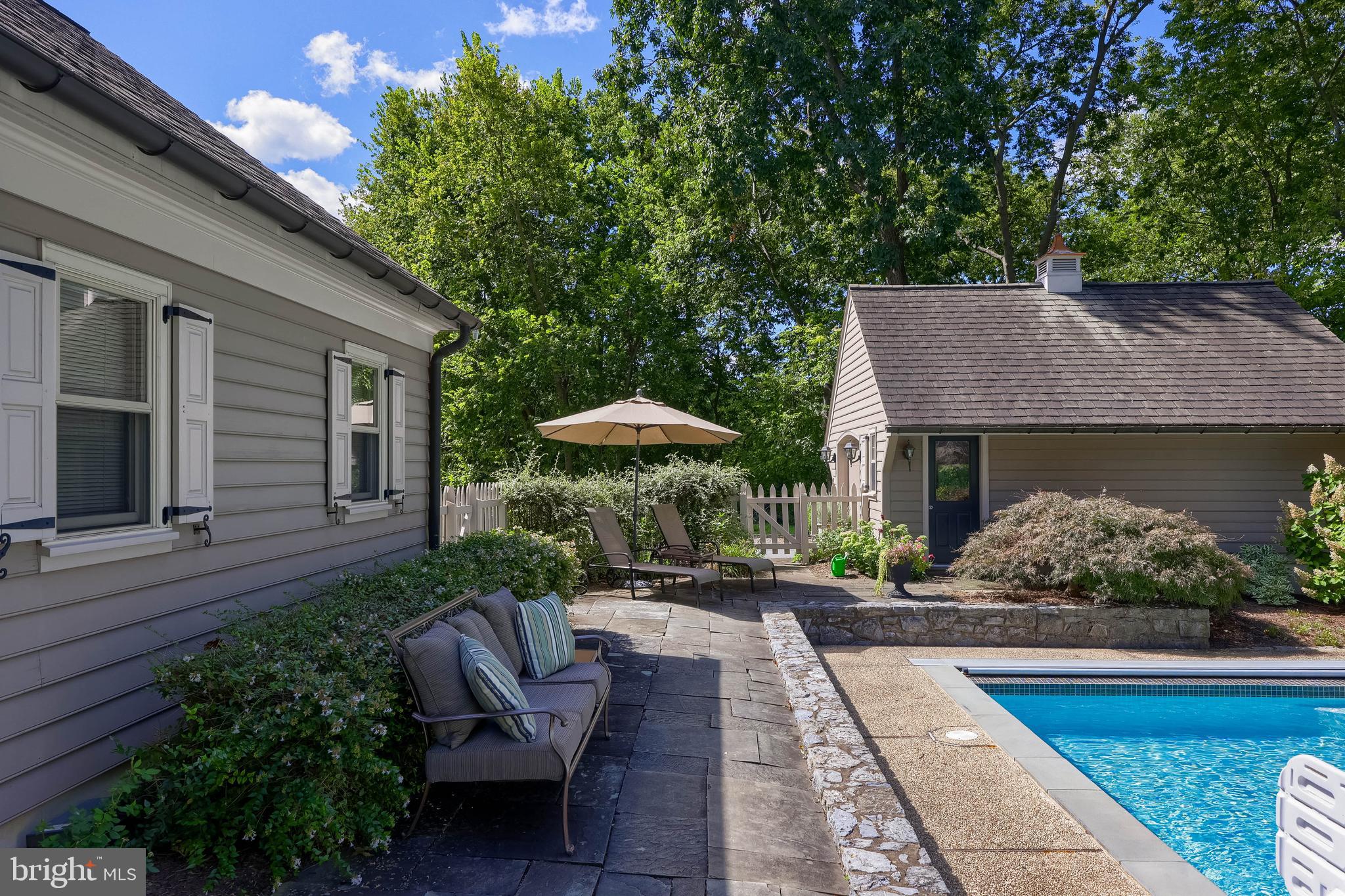 38 Westwind Circle Lititz, PA 17543 - Photo 68 of 113 a view of a patio with table and chairs potted plants and a large tree