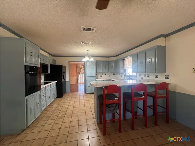 a view of a livingroom with a staircase