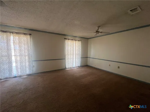 a view of storage and utility room with racks on the wall