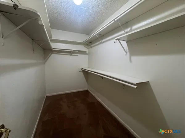 a spacious bathroom with a double vanity sink and a mirror