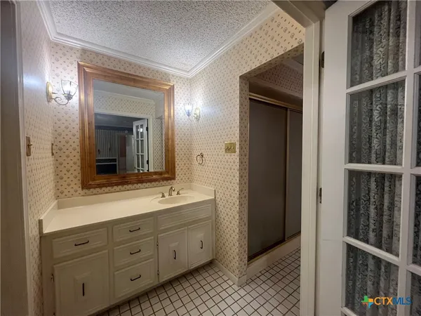 a bathroom with a double vanity sink and mirror