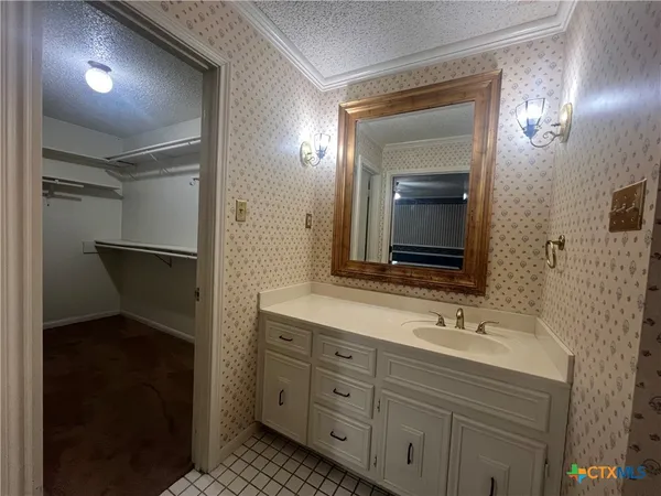 a bathroom with a toilet and a sink
