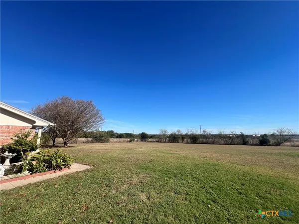 a view of a lake with houses in the background