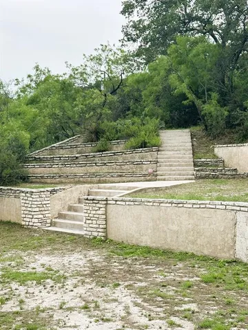 a view of a swimming pool and a yard