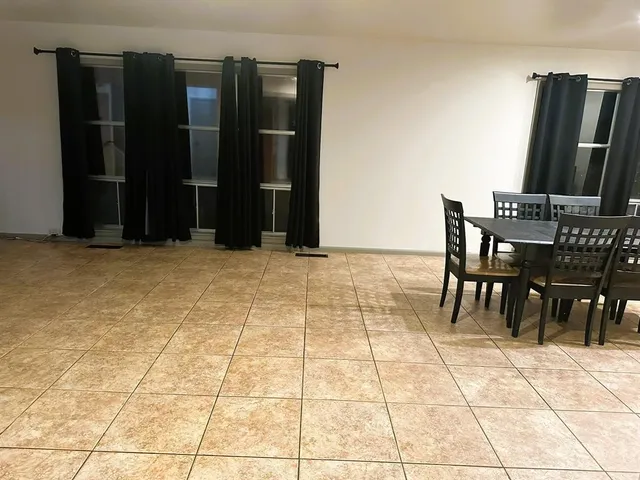 a view of a chairs and table in a room