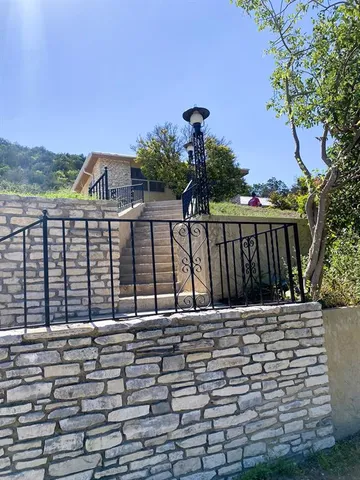 a view of a roof with wooden floor and fence