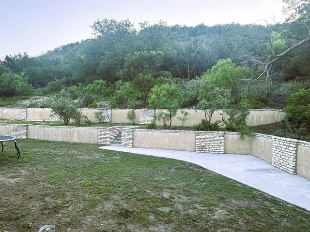 a view of a backyard with a small pool