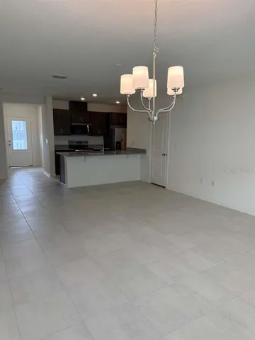 a view of kitchen and living room with sink