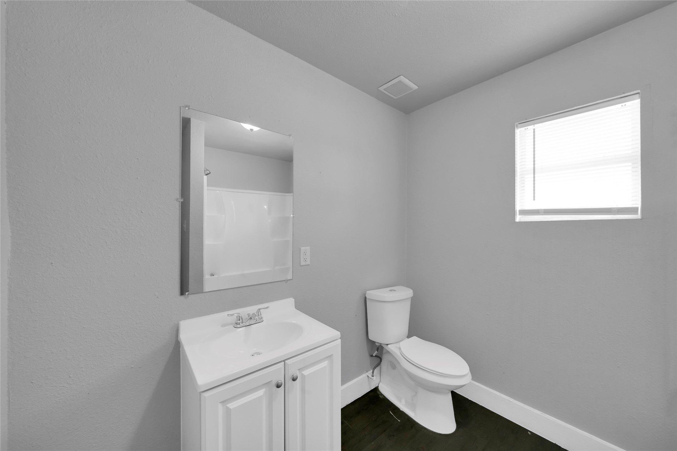 6518 Weston Street, Unit 1 Houston, TX 77021 - Photo 3 of 15 a bathroom with a sink a toilet and a window