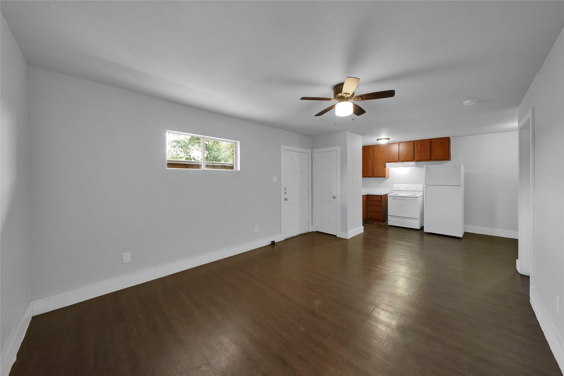 6518 Weston Street, Unit 1 Houston, TX 77021 - Photo 4 of 15 a view of empty room with wooden floor and fan