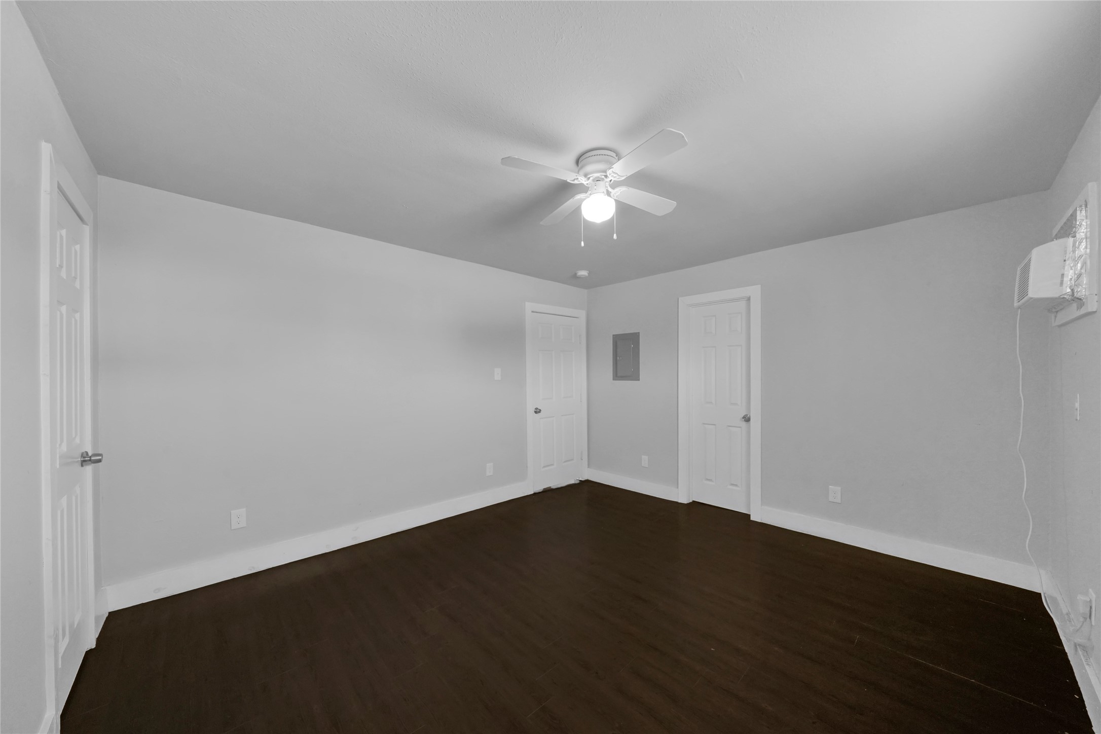 6518 Weston Street, Unit 1 Houston, TX 77021 - Photo 10 of 15 an empty room with a ceiling fan and wooden floor