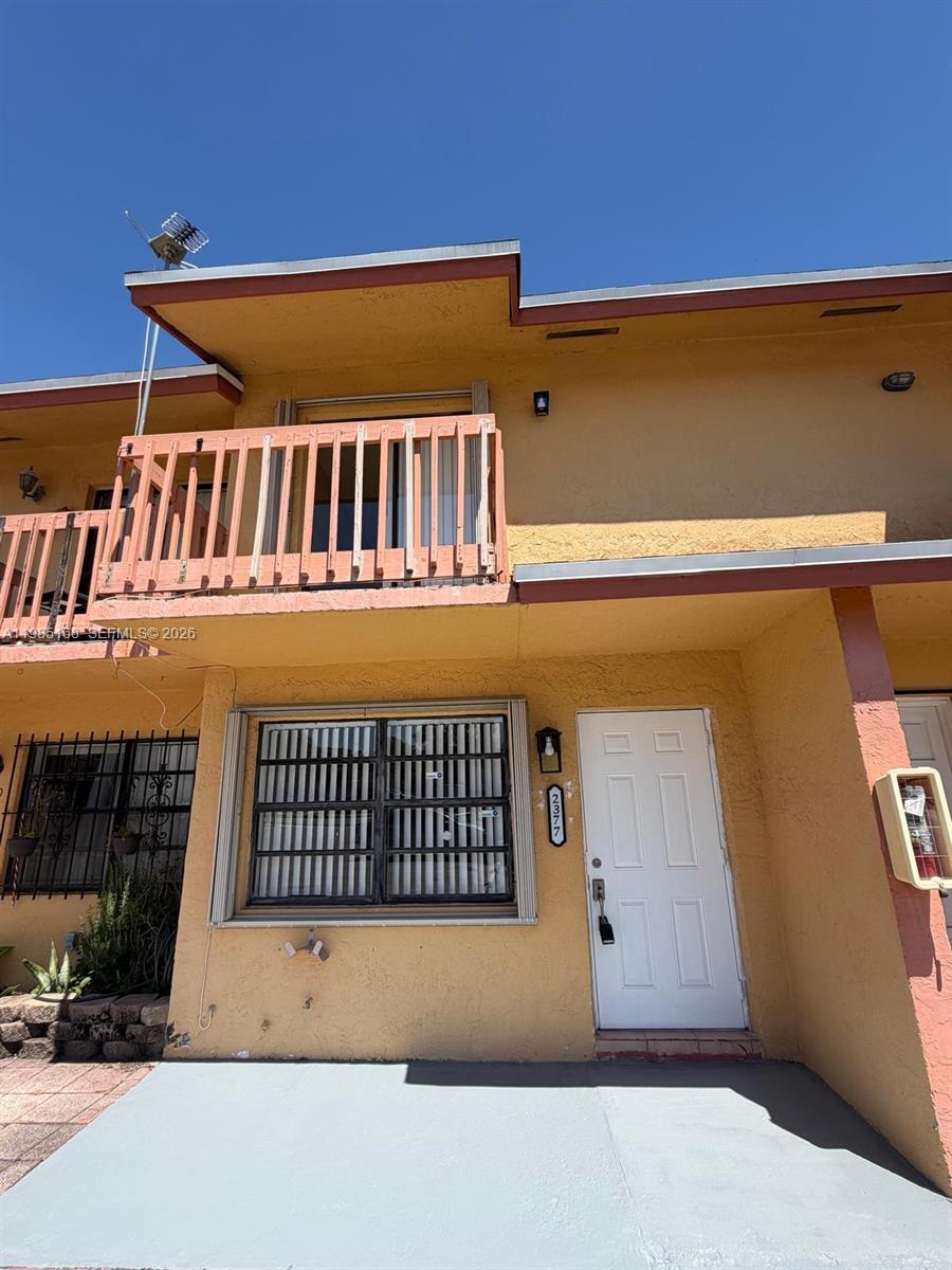 2377 West 66th Place, Unit 204 Hialeah, FL 33016 - Photo 1 of 12 a view of balcony with door