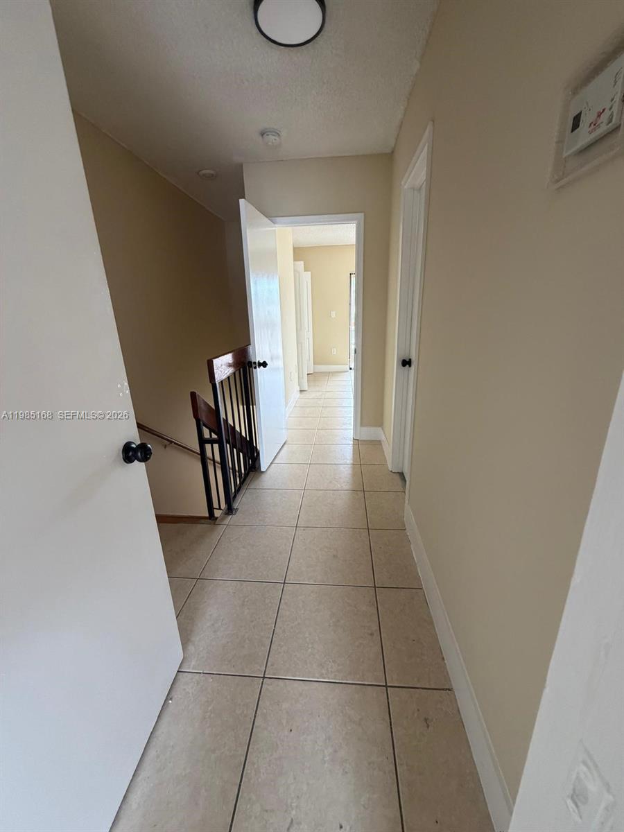 2377 West 66th Place, Unit 204 Hialeah, FL 33016 - Photo 11 of 12 a view of a livingroom with furniture and front door