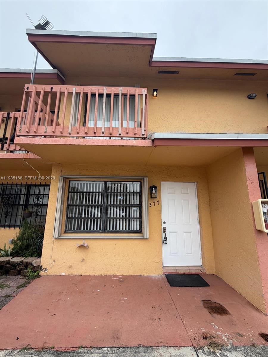 2377 West 66th Place, Unit 204 Hialeah, FL 33016 - Photo 2 of 12 a view of a house with porch