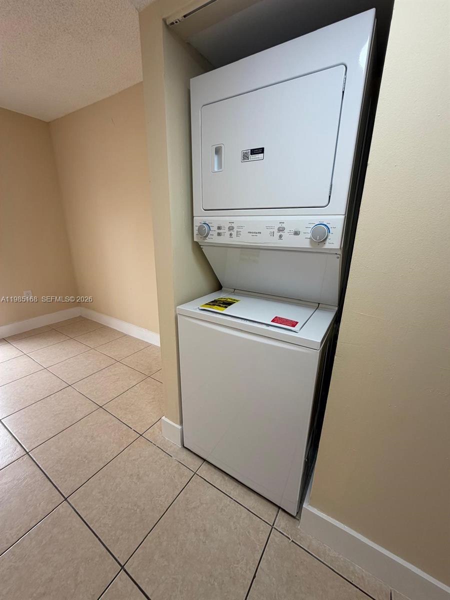2377 West 66th Place, Unit 204 Hialeah, FL 33016 - Photo 5 of 12 a utility room with dryer and washer