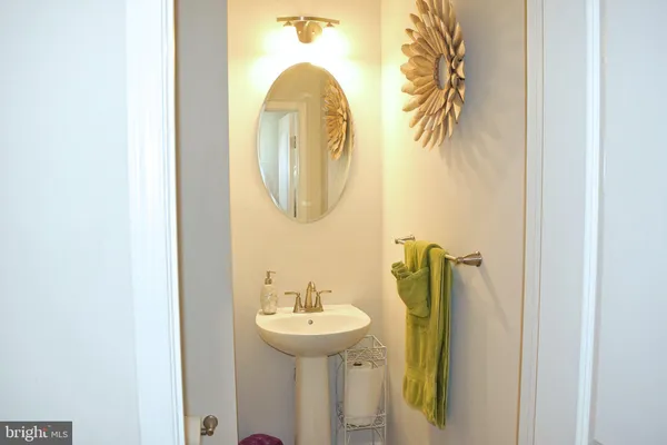 a bathroom with a sink and mirror