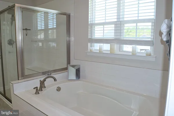 a white toilet sitting next to a sink