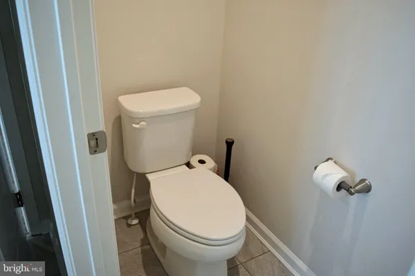 a bedroom with a bed and a chair