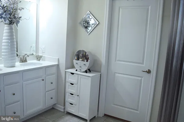 a bedroom with a bed and flat screen tv