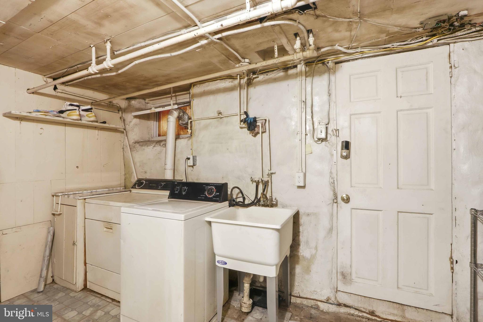 1546 Lochwood Road Baltimore, MD 21218 - Photo 15 of 19 a utility room with a washer and dryer