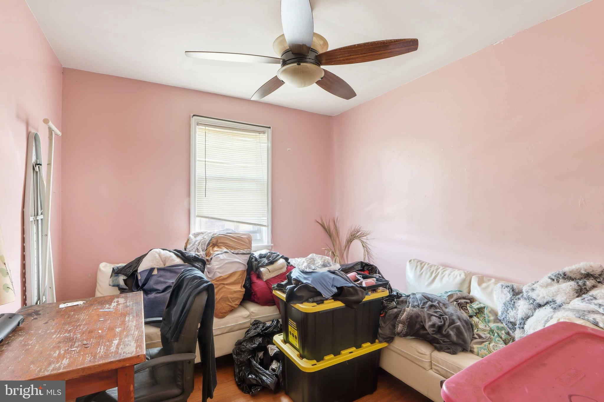 1546 Lochwood Road Baltimore, MD 21218 - Photo 9 of 19 a living room with furniture and a window