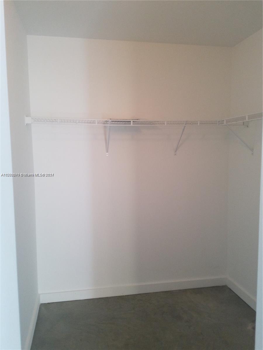 Downtown Miami Miami, FL 33131 - Photo 16 of 26 a view of small space with racks on the wall