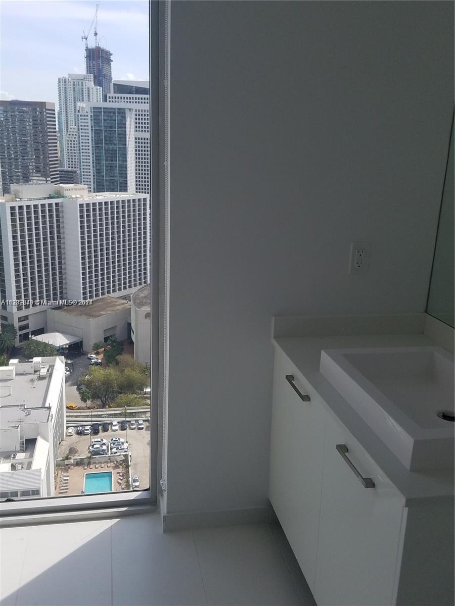 Downtown Miami Miami, FL 33131 - Photo 18 of 26 a view of a room with racks on the wall