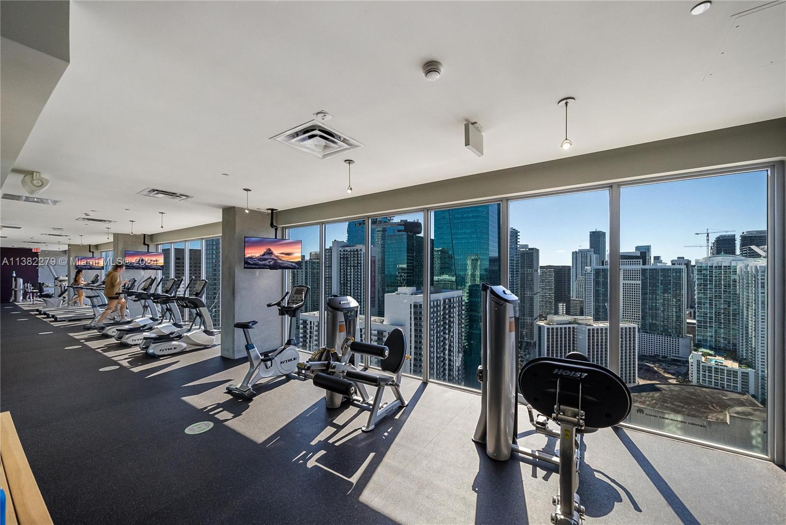 Downtown Miami Miami, FL 33131 - Photo 23 of 26 a room with gym equipment and a large window