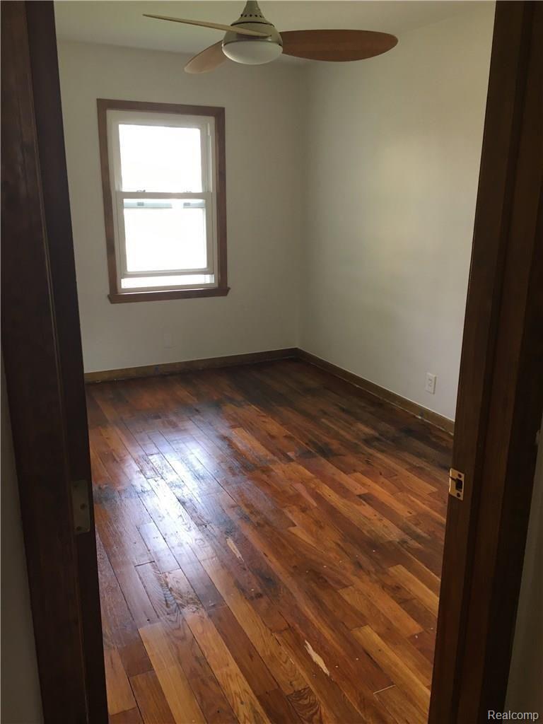 17608 Reed Street Melvindale, MI 48122 - Photo 8 of 14 Bedroom Number 1. Freshly Painted & Refinished Hardwood Floors.