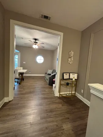 a view of front door with wooden floor