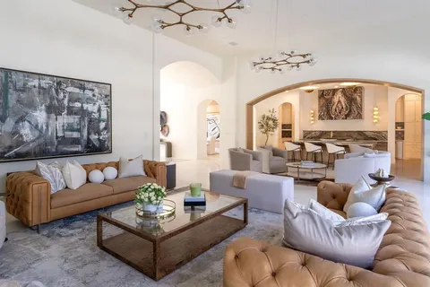 a living room with furniture or couch and a large window