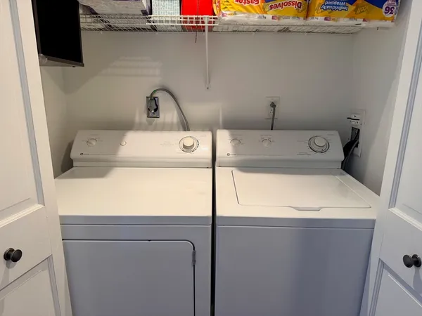 a utility room with dryer and washer