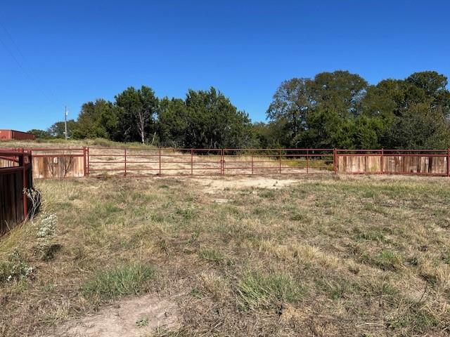 8901 Edwards Road Tolar, TX 76476 - Photo 4 of 24 a backyard of a house with lots of green space