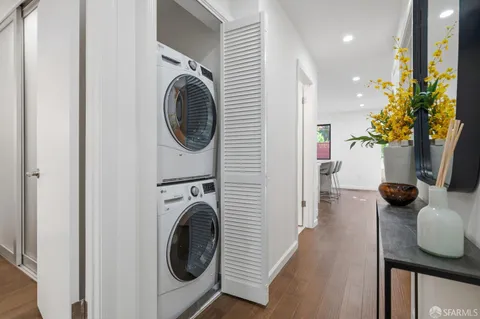 a view of a hallway with washer and dryer
