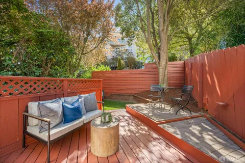 a view of a wooden bench in the backyard