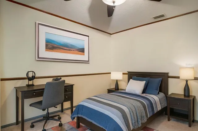 a bathroom with a granite countertop sink toilet a mirror a vanity and shower
