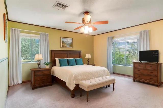 a spacious bathroom with a tub sink shower and mirror