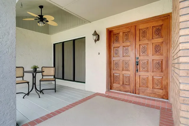 a view of a dining room with furniture wooden floor and chandelier