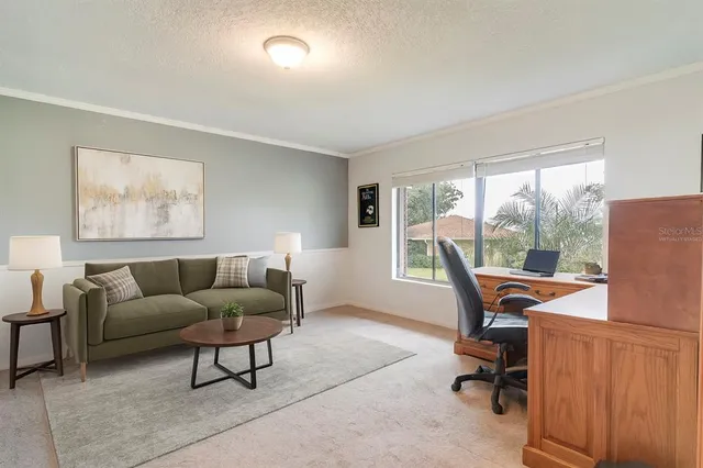 a living room with furniture and a table
