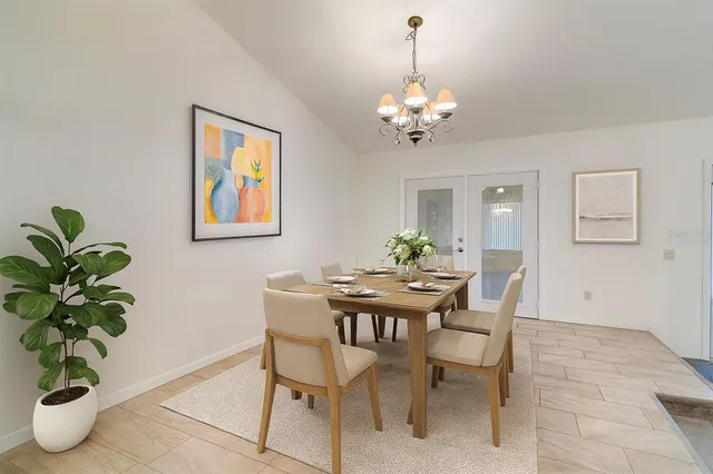 a kitchen with stainless steel appliances granite countertop a stove a sink dishwasher and a refrigerator