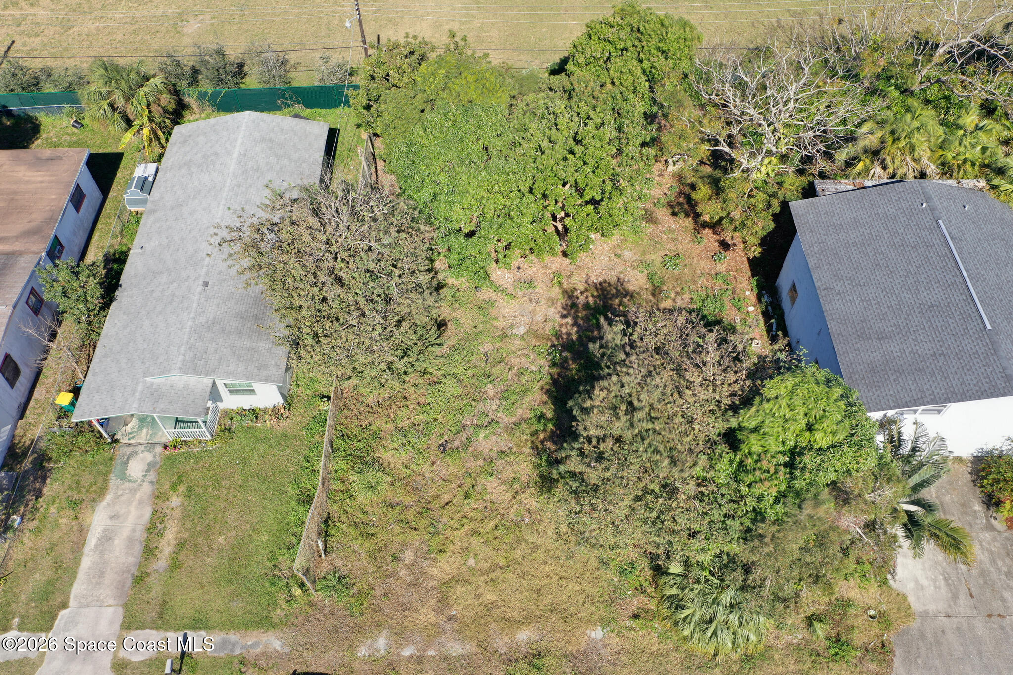 504 Burr Street Melbourne, FL 32901 - Photo 14 of 20 an aerial view of a house with a yard