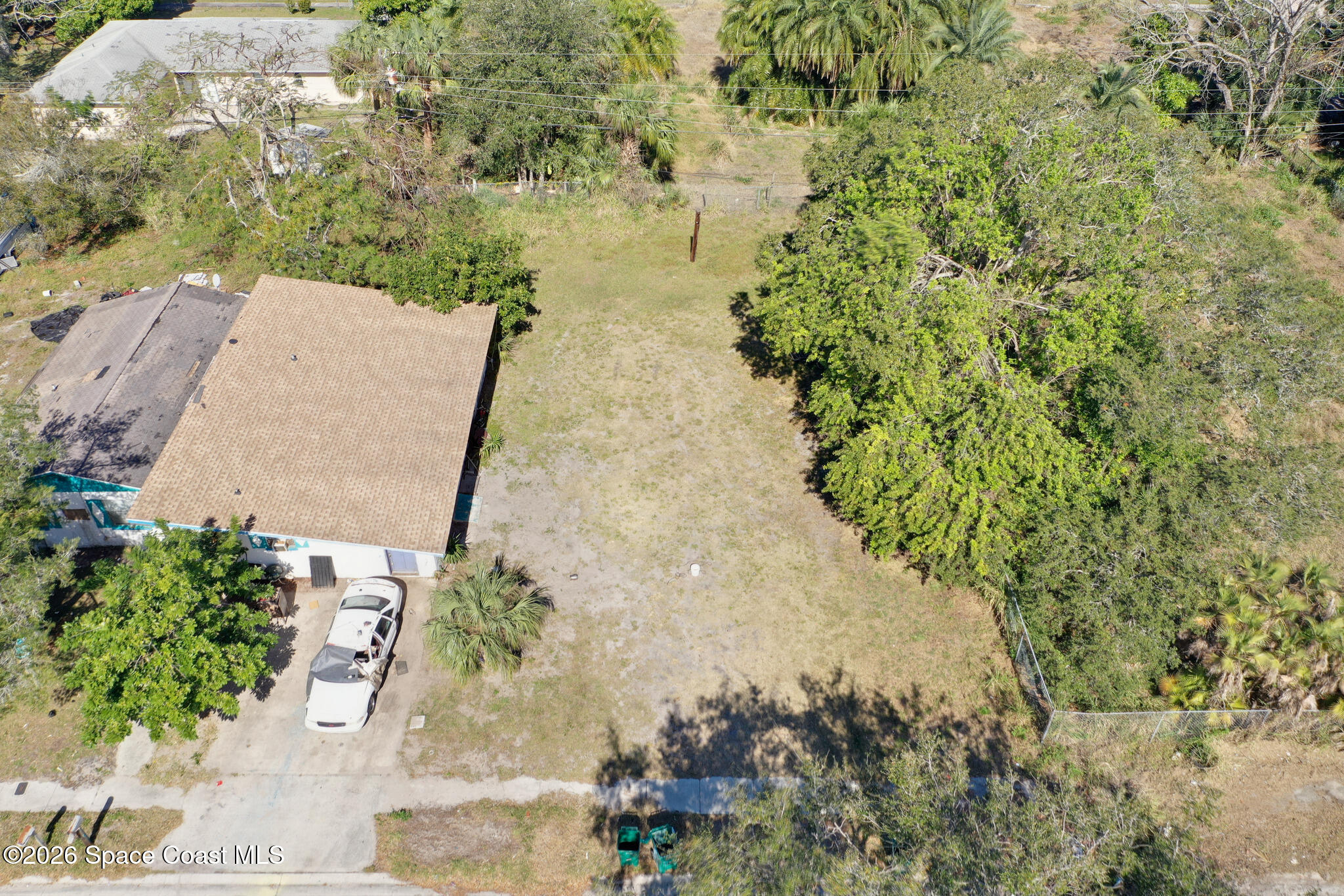504 Burr Street Melbourne, FL 32901 - Photo 16 of 20 an aerial view of a house with a yard