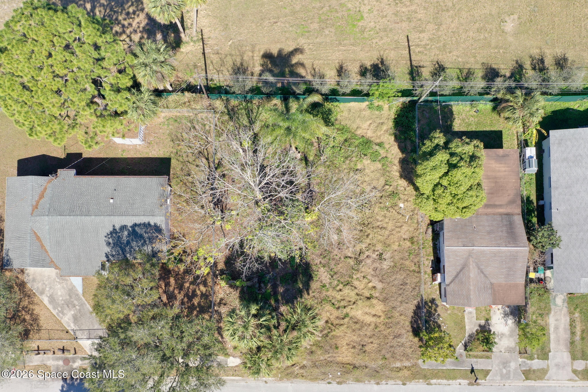 504 Burr Street Melbourne, FL 32901 - Photo 20 of 20 an aerial view of a house with a yard and lake view