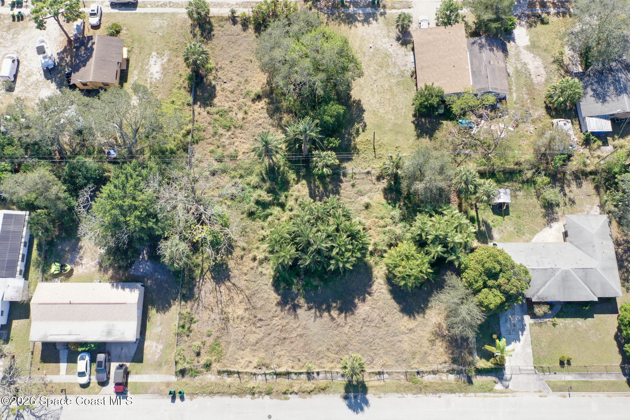 504 Burr Street Melbourne, FL 32901 - Photo 4 of 20 an aerial view of multiple houses with yard