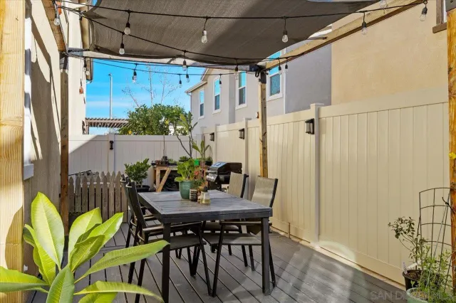 a view of a balcony with chair and wooden floor