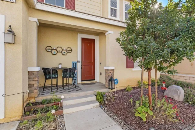 a front view of a house with garden